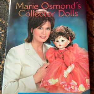 Marie osmond doll in original box with book.